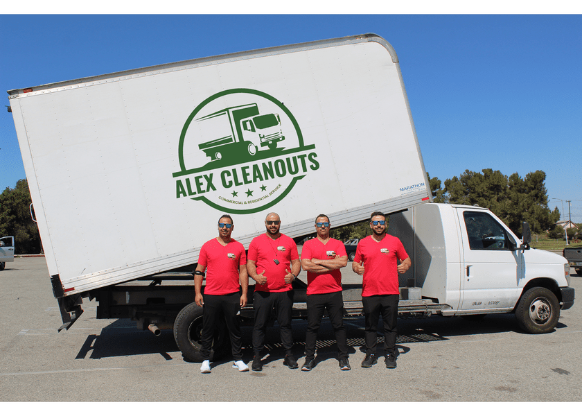 Alex cleanouts team posing with white truck