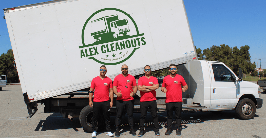 Alex cleanouts team posing with white junk truck